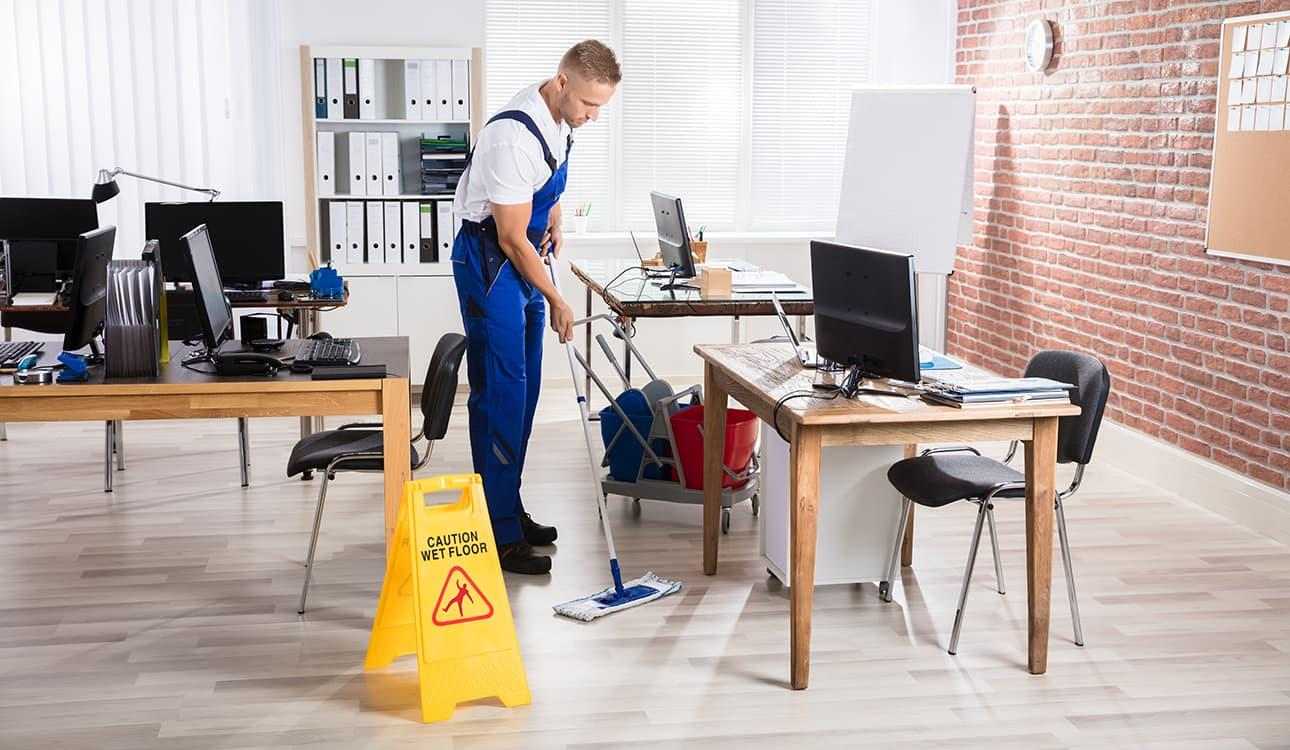 Office Cleaning service in Orlando Winter Park Florida 2025 a guy in dress in front of computer desk